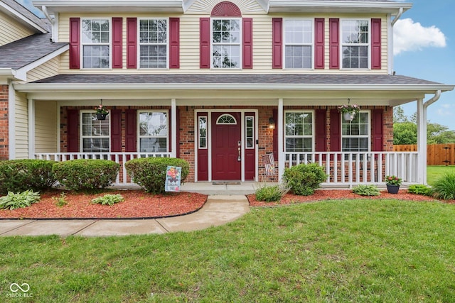 4434 W Windsong Ct, New Palestine, IN 46163 - view of front of property featuring a porch, a front lawn, and brick siding