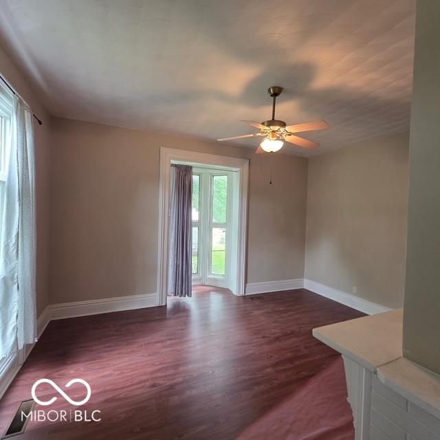 517 E Mechanic St, Brazil, IN 47834 - spare room featuring baseboards, wood finished floors, and a ceiling fan