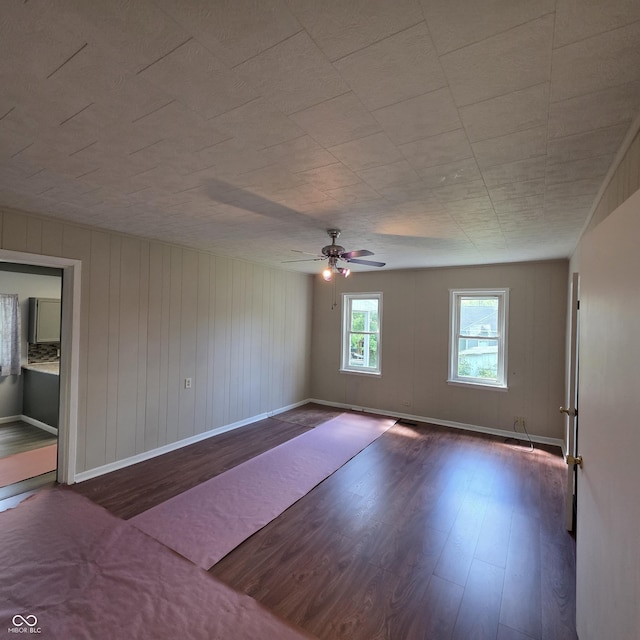 517 E Mechanic St, Brazil, IN 47834 - spare room with wood finished floors, ceiling fan, and baseboards