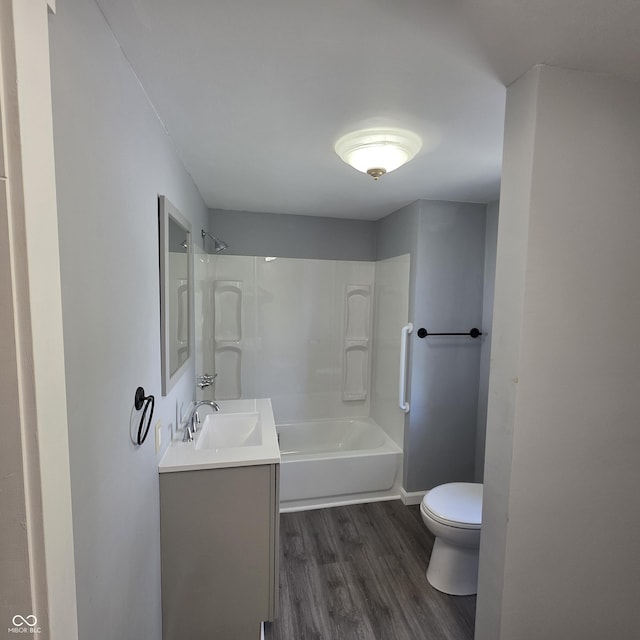 517 E Mechanic St, Brazil, IN 47834 - full bath featuring toilet, wood finished floors, vanity, and shower / tub combination