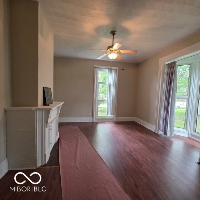 517 E Mechanic St, Brazil, IN 47834 - spare room with baseboards, dark wood-style flooring, and a ceiling fan