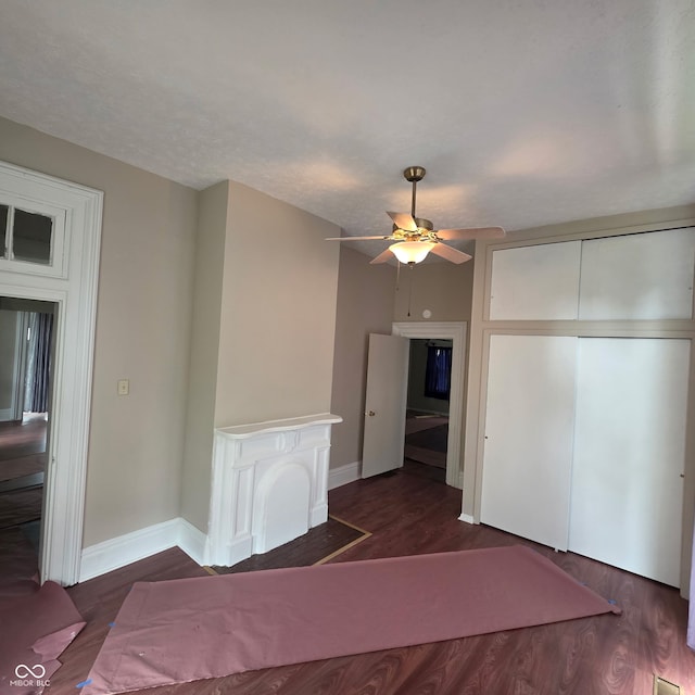 517 E Mechanic St, Brazil, IN 47834 - unfurnished bedroom with wood finished floors, baseboards, a closet, and a ceiling fan