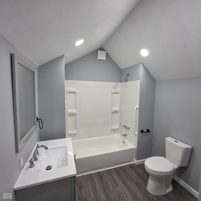 517 E Mechanic St, Brazil, IN 47834 - bathroom with toilet, wood finished floors, vanity, lofted ceiling, and bathtub / shower combination