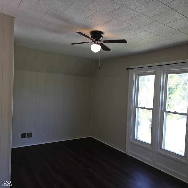 517 E Mechanic St, Brazil, IN 47834 - spare room featuring dark wood finished floors, a ceiling fan, and baseboards