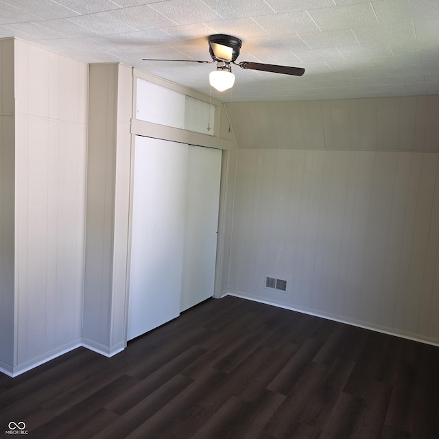 517 E Mechanic St, Brazil, IN 47834 - unfurnished bedroom featuring dark wood-type flooring, baseboards, ceiling fan, and a closet