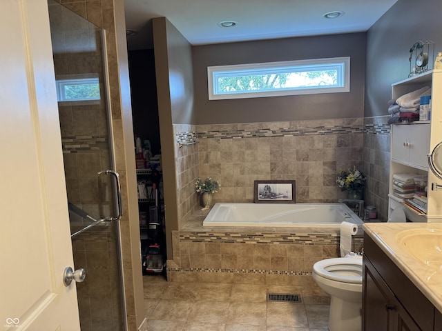 532 N Franklin St, Greensburg, IN 47240 - full bathroom featuring a bath, vanity, toilet, tile patterned flooring, and tiled shower