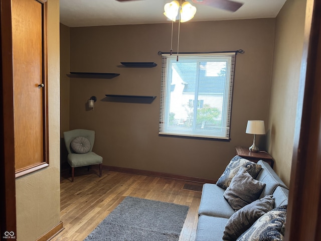 532 N Franklin St, Greensburg, IN 47240 - living area with light wood-style flooring, a ceiling fan, and baseboards