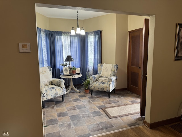 532 N Franklin St, Greensburg, IN 47240 - sitting room with a chandelier, baseboards, and stone finish flooring