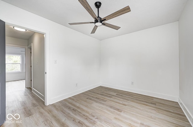 815 E 24th St E, Indianapolis, IN 46205 - empty room featuring a ceiling fan, wood finished floors, and baseboards