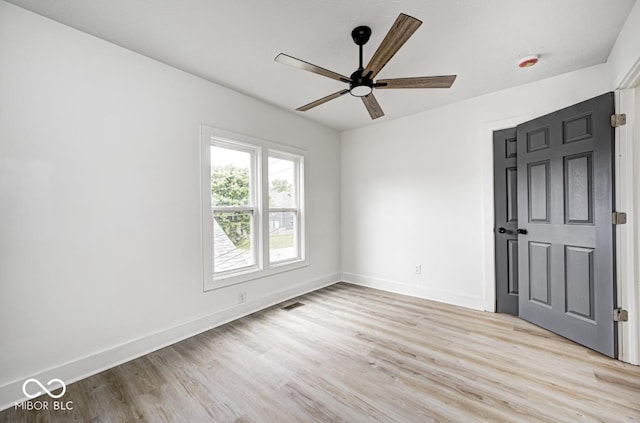 815 E 24th St E, Indianapolis, IN 46205 - unfurnished bedroom featuring light wood-style flooring, baseboards, and ceiling fan