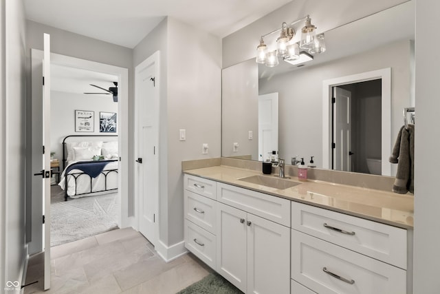 4808 Lakeview Dr, Greenwood, IN 46143 - bathroom featuring vanity, ceiling fan, toilet, and baseboards