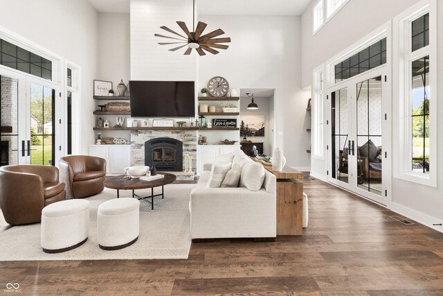 4808 Lakeview Dr, Greenwood, IN 46143 - living area with a towering ceiling, healthy amount of natural light, dark wood-style floors, ceiling fan, and baseboards