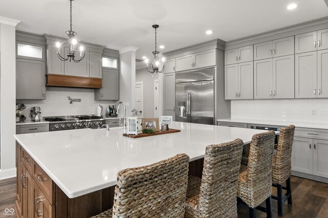 4808 Lakeview Dr, Greenwood, IN 46143 - kitchen with stainless steel fridge with ice dispenser, gray cabinetry, dark wood-type flooring, stove, and recessed lighting