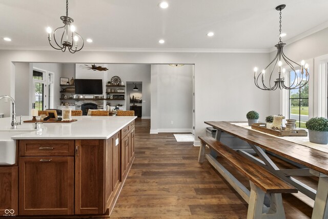 4808 Lakeview Dr, Greenwood, IN 46143 - kitchen featuring a chandelier, a sink, a fireplace, healthy amount of natural light, and recessed lighting