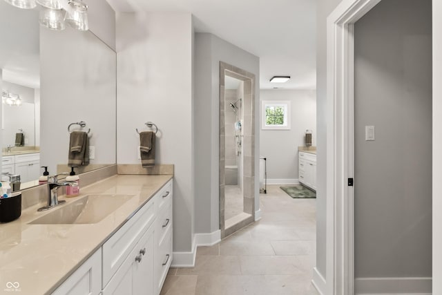 4808 Lakeview Dr, Greenwood, IN 46143 - bathroom featuring a stall shower, vanity, baseboards, and tile patterned floors