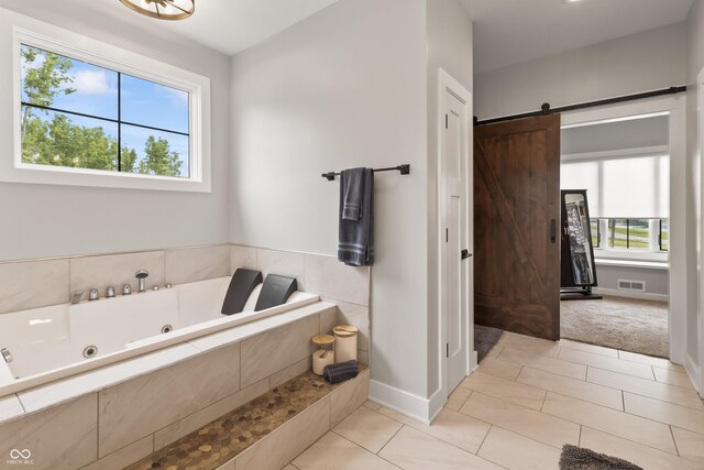 4808 Lakeview Dr, Greenwood, IN 46143 - bathroom featuring a jetted tub, baseboards, and tile patterned flooring