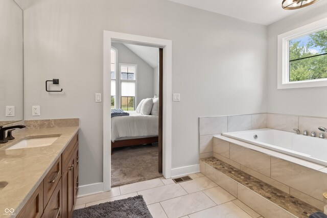 4808 Lakeview Dr, Greenwood, IN 46143 - bathroom with double vanity, ensuite bath, baseboards, and healthy amount of natural light