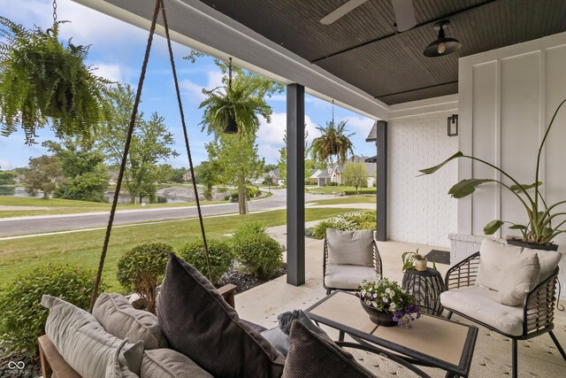 4808 Lakeview Dr, Greenwood, IN 46143 - view of patio / terrace with a water view and a ceiling fan