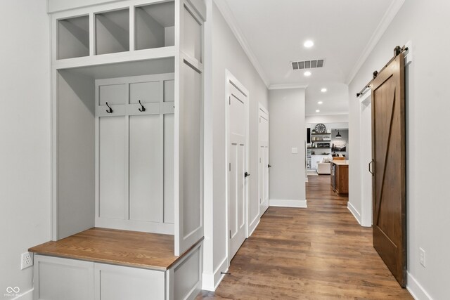 4808 Lakeview Dr, Greenwood, IN 46143 - mudroom featuring ornamental molding, a barn door, wood finished floors, and recessed lighting