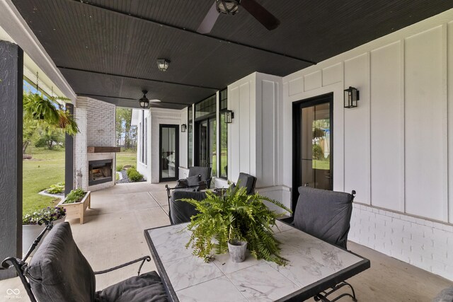 4808 Lakeview Dr, Greenwood, IN 46143 - view of patio featuring a fireplace and a ceiling fan