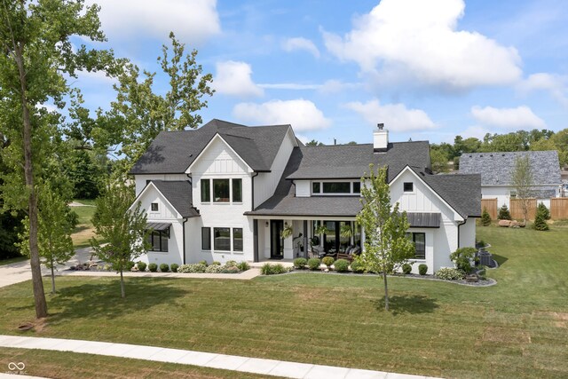 4808 Lakeview Dr, Greenwood, IN 46143 - modern inspired farmhouse with a porch, a chimney, a shingled roof, and board and batten siding