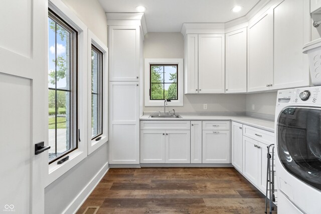 4808 Lakeview Dr, Greenwood, IN 46143 - laundry area featuring washer / clothes dryer, cabinet space, dark wood-style floors, recessed lighting, and baseboards