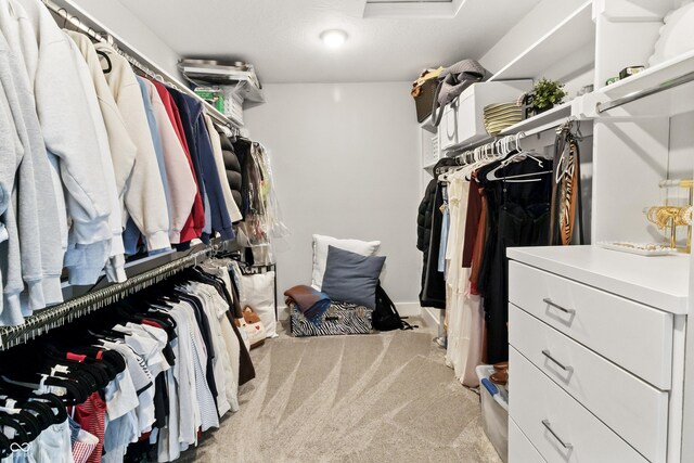 4808 Lakeview Dr, Greenwood, IN 46143 - walk in closet featuring attic access and carpet