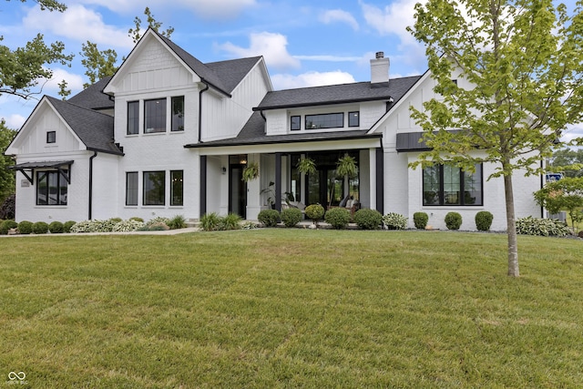 4808 Lakeview Dr, Greenwood, IN 46143 - modern farmhouse featuring board and batten siding, roof with shingles, and a chimney