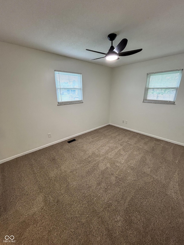 1653 Wade St, Indianapolis, IN 46203 - unfurnished room featuring carpet flooring, a ceiling fan, baseboards, and a textured ceiling