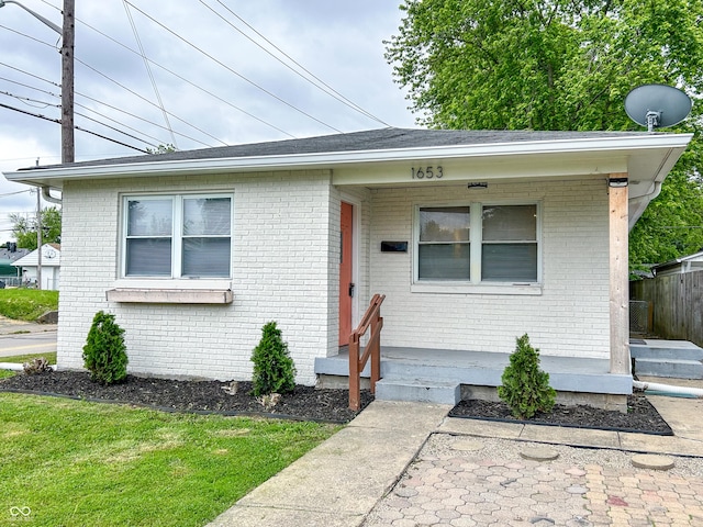 1653 Wade St, Indianapolis, IN 46203 - view of front of home featuring brick siding