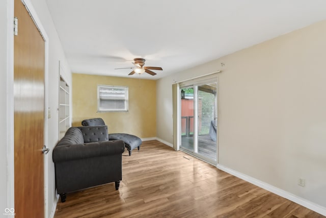 410 E Southport Rd, Indianapolis, IN 46227 - sitting room featuring wood finished floors, a ceiling fan, and baseboards