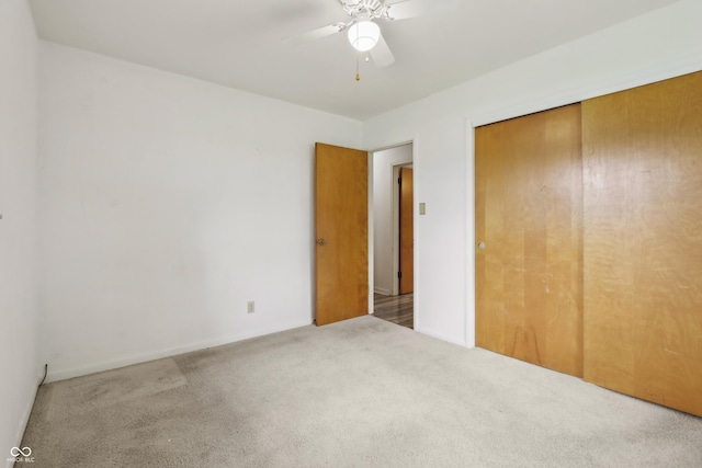 410 E Southport Rd, Indianapolis, IN 46227 - unfurnished bedroom with carpet floors, a closet, ceiling fan, and baseboards