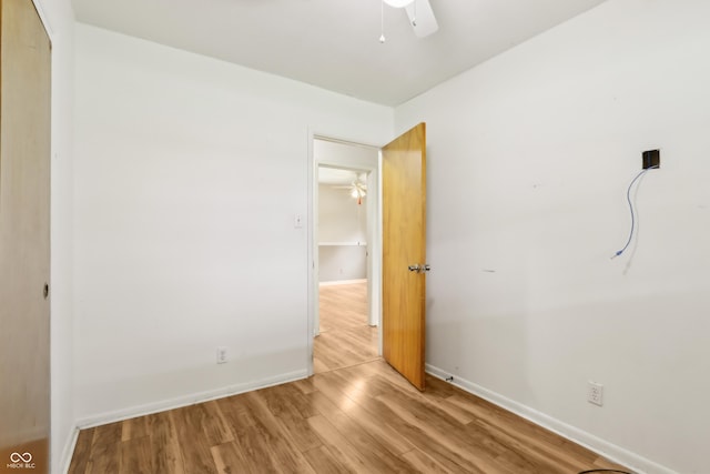 410 E Southport Rd, Indianapolis, IN 46227 - unfurnished bedroom with wood finished floors, baseboards, and a closet