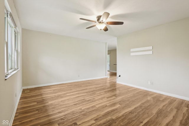 410 E Southport Rd, Indianapolis, IN 46227 - unfurnished room with ceiling fan, light wood-style flooring, and baseboards