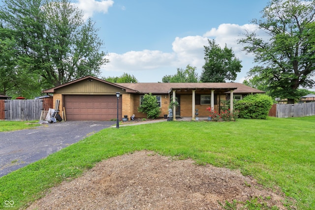410 E Southport Rd, Indianapolis, IN 46227 - single story home with driveway, an attached garage, a porch, and brick siding