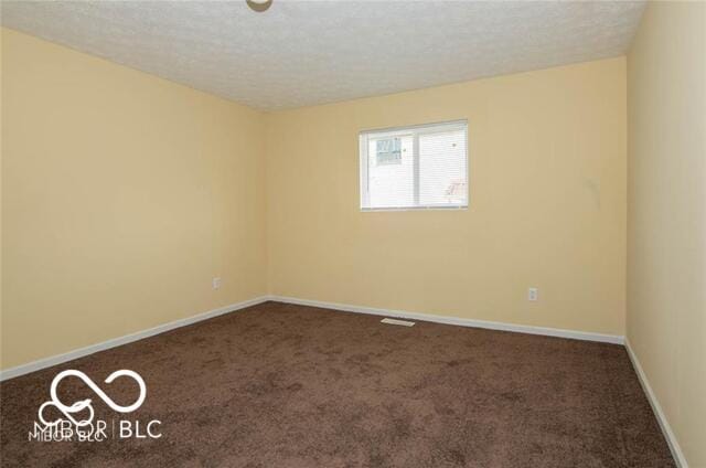 8361 Paso Del Norte Ct, Indianapolis, IN 46227 - unfurnished room with carpet flooring, baseboards, and a textured ceiling