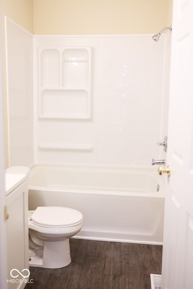 8361 Paso Del Norte Ct, Indianapolis, IN 46227 - bathroom featuring washtub / shower combination, wood finished floors, and toilet