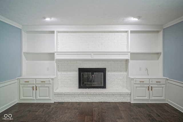 4949 Jennings Dr, Carmel, IN 46033 - unfurnished living room with dark wood finished floors, crown molding, wainscoting, and a brick fireplace