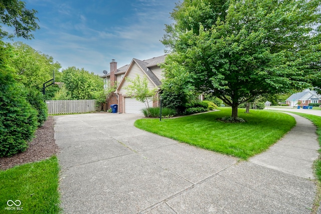 4949 Jennings Dr, Carmel, IN 46033 - view of home's exterior with driveway, brick siding, a chimney, and a garage