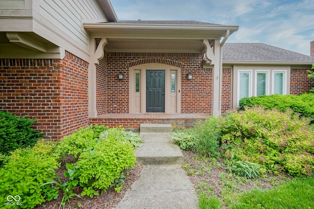4949 Jennings Dr, Carmel, IN 46033 - doorway to property with brick siding and a shingled roof