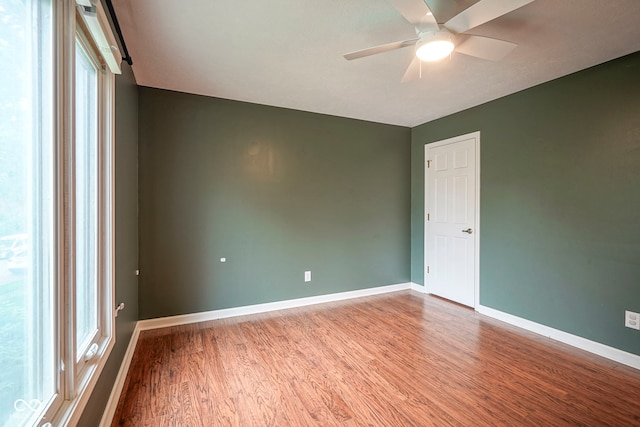 4949 Jennings Dr, Carmel, IN 46033 - spare room with wood finished floors, baseboards, and a ceiling fan