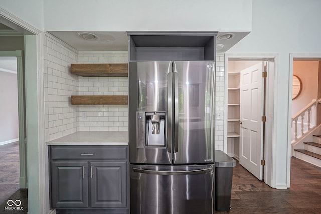 4949 Jennings Dr, Carmel, IN 46033 - kitchen with stainless steel fridge, open shelves, gray cabinetry, tasteful backsplash, and dark wood-style flooring