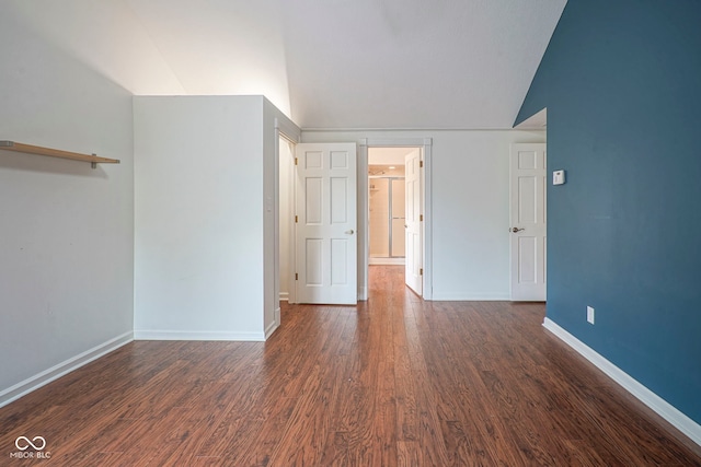 4949 Jennings Dr, Carmel, IN 46033 - spare room featuring dark wood-style flooring, baseboards, and lofted ceiling