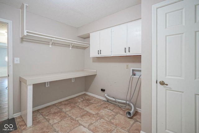 4949 Jennings Dr, Carmel, IN 46033 - laundry area with cabinet space, washer hookup, a textured ceiling, baseboards, and a desk