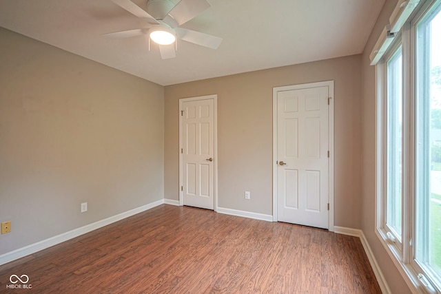 4949 Jennings Dr, Carmel, IN 46033 - unfurnished bedroom with dark wood finished floors, baseboards, and ceiling fan