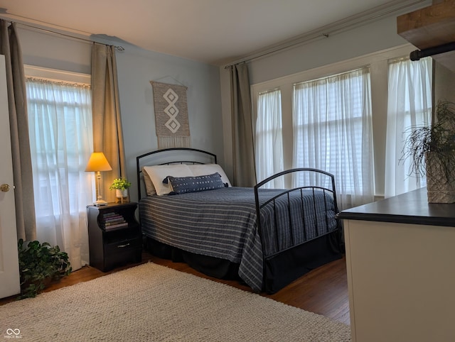 1728 Newton St, Columbus, IN 47201 - bedroom featuring multiple windows and wood finished floors