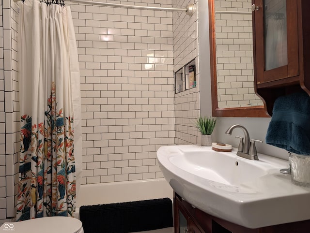 1728 Newton St, Columbus, IN 47201 - full bath featuring shower / bath combo with shower curtain, toilet, and vanity