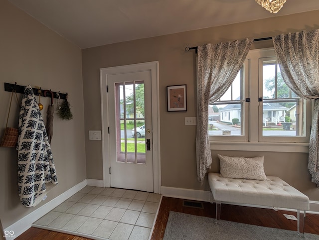 1728 Newton St, Columbus, IN 47201 - doorway featuring baseboards and light tile patterned floors