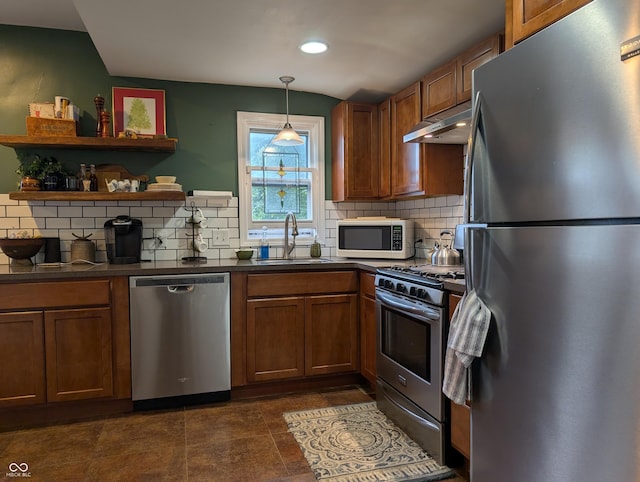 1728 Newton St, Columbus, IN 47201 - kitchen featuring stainless steel appliances, a sink, dark countertops, brown cabinetry, and recessed lighting