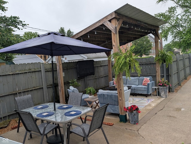 1728 Newton St, Columbus, IN 47201 - fenced backyard with an outdoor hangout area, a patio area, and outdoor dining space